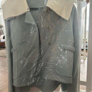 Stylish Blue Jacket with Cream Collar